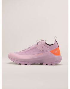 a pink shoe with an orange sole