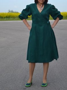 This natural linen wrap dress is a beautiful style dress with functional side pockets and puffy sleeve design. Dress is made from soft, lightweight linen, it is designed for comfort and style. With 3/4 sleeves, loose fit, with a belt, It's the perfect dress for any casual occasion, practical and comfortable. The sleeves bottom part is with an elastic strap. Check your measurements in the size chart before ordering!! THE Fabric is made from 100% Lithuanian linen. The color might be slightly diffe Spring Linen Dress With Gathered Sleeves, Short Sleeve Linen Midi Dress For Fall, Fitted Linen Midi Dress With Pockets, Spring Linen Midi Dress With Surplice Neckline, Spring Linen Dress With Surplice Neckline, Linen Dress With Gathered Short Sleeves, Linen Midi Dress With Gathered Sleeves, Fitted Green Linen Midi Dress, Elegant Linen V-neck Midi Dress