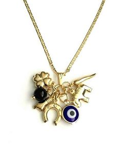 "18k gold filled charm elephant ,evil eye,figa hand,horn clover and horseshoe necklace 20\" long chain. for good luck and money. 18k gold filled cadena de elefante,ojo,trebol,chilli y herradura. 20\" largo cadena. para buena suerte,prosperidad,dinero." Money Necklace, Goodluck Charms, Good Luck Bracelet, Horseshoe Necklace, For Good Luck, Unusual Jewelry, Pompano Beach, Jewelry Lookbook, Evil Eye Pendant