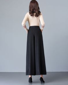 * A simple wide leg pants for winter, made of quality wool blends. * Two pockets, they are big enough for Iphone and your hands. * Fixed waist with zipper and button. * Material: 50% wool, 50% polyester; lining-100% polyester * Washing instructions: Dry Clean Only * Let us know your usual size in your country and your overall height. * Can custom make waist size and length. * Size: True to US size, US 0-US 20 are available, you can let us know your usual size and height in your order. * Shipping Solid Wide Leg Winter Pants, Solid Color Wide Leg Winter Pants, Winter Solid Full-length Bottoms, Full-length Dress Pants With Pockets For Winter, Winter Full-length Dress Pants With Pockets, Black Wide Leg Winter Pants, Non-stretch Wide Leg Pants For Fall, Non-stretch Solid Wide Leg Pants For Fall, Solid Non-stretch Wide Leg Pants For Fall