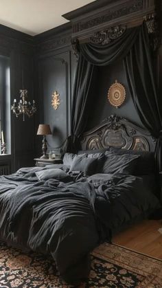 a large bed sitting next to a window in a dark colored room with an ornate headboard