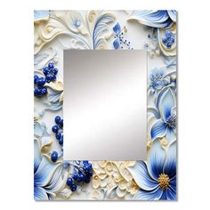 a mirror with blue flowers on it and a white border around the edges, in front of a white background