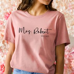 Personalised Mrs t-shirt with last name and established date This Mrs T-shirt is perfect for the bride-to-be. It features her last name and their established date, making it a meaningful and personal gift that can be worn at the wedding and beyond. It's also a great honeymoon gift. Future Mrs Shirt, Honeymoon Gift, Mrs Shirt, Honeymoon Gifts, Last Names, Gift For Bride, Future Mrs, Bride Gifts, Hen