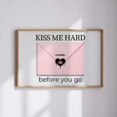 a pink envelope with the words kiss me hard before you go