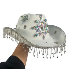 Our Cowgirl Hats are a stylish addition to your rave wardrobe, and come in Pink & White Flames, Black and Red Flames, Black Gems, and White Gems to match any outfit!