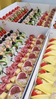 an assortment of appetizers are displayed in trays