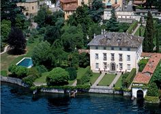 an aerial view of a house on the water