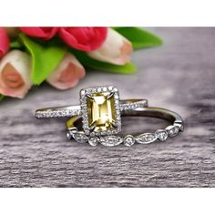 an engagement ring with a yellow diamond surrounded by diamonds