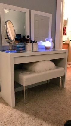 a white bench with a mirror and lights on it