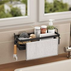 a bathroom sink with soap, lotion and other items on the shelf next to it