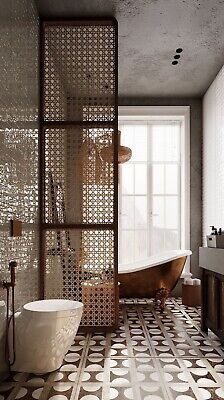 a bath room with a tub a sink and a window