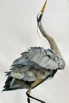 a watercolor painting of a crane standing on its legs