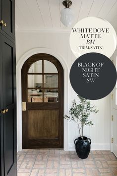 a black vase sitting in front of a door with the words white dove matte on it