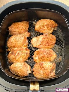 chicken is cooking in an air fryer