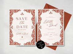 a wedding card with an orange and white border on it, next to two red envelopes