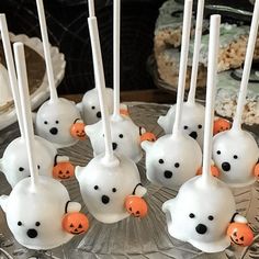 halloween marshmallows with ghost faces and jack - o'- lanterns on them