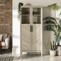 a tall wooden cabinet sitting next to a plant in a living room filled with furniture