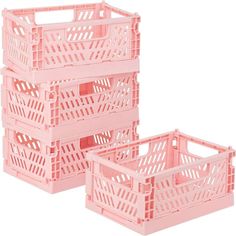 three pink plastic crates sitting next to each other