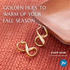 A pair of gold dangly earrings propped onto a wooden tray over an orange background. Fall Is Coming, Fall Season