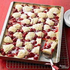 a pan filled with dessert on top of a red table