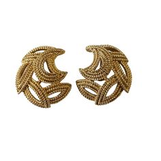 These vintage Crown Trifari clip-on earrings are a stylish addition to any jewelry collection. The gold tone base metal gives them a classic feel, while the brand name adds a touch of elegance. The clip-on closure ensures they can be worn comfortably by anyone without the need for pierced ears. 1" h by 0.75"w by 0.25" D    Perfect for a night out or to add a touch of glamour to an everyday outfit, these Trifari earrings are a must-have for vintage jewelry enthusiasts. Vintage Yellow Gold Metal Clip-on Earrings, Vintage Gold-tone Earrings, Vintage Gold-tone Clip-on Earrings For Evening, Gold-tone Brass Clip-on Earrings For Formal Occasions, Vintage Brass Clip-on Earrings, Vintage Gold-tone Earrings For Evening, Vintage Gold-tone Evening Earrings, Gold Metal Clip-on Earrings For Formal Occasions, Formal Brass Clip-on Hoop Earrings