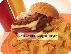 a cheeseburger and chips on a plate with the words chili cheese bologna burgers