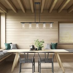 a dining room with wooden walls and flooring