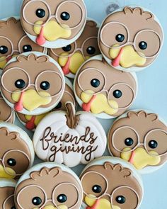 a bunch of cookies that are shaped like turkeys with the words friendly giving written on them