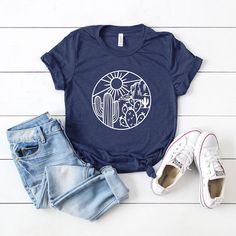 Looking for a cute versatile top to wear? Make sure to grab one of our Graphic tees! This soft and comfortable graphic tee is the perfect top for any outfit. It can be paired with biker shorts, jeans, or even a simple skirt/dress! This tee is true-to-size, so be sure to order your regular t-shirt size! If you are looking for a more oversized look, make sure to size up! Mauve Blush, White Ink, Army Green, Navy And White, Sleeve Styles, Fitness Fashion, Shirts Tops, Graphic Tees, Casual Outfits