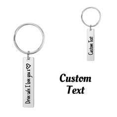 two key chains with the words custom text on them