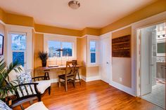 a living room filled with furniture and wooden floors