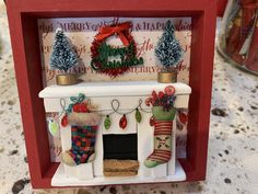 a christmas fireplace with stockings and stockings on it