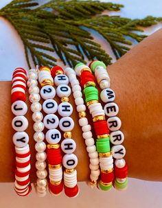 the bracelets are decorated with letters and beads