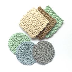 three crocheted coasters sitting next to each other