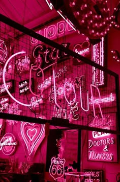 pink neon signs and lights in a room