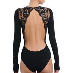 the back of a woman wearing a black bodysuit