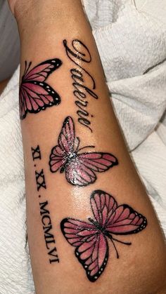 a woman's arm with three pink butterflies on it and the words i love my mommy written in cursive writing