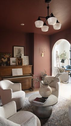 a living room filled with furniture and a piano