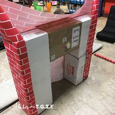 the cardboard house is made to look like it's been built into a wall