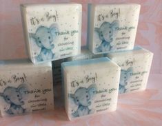 four soap bars with blue elephants on them and thank you written on the front one