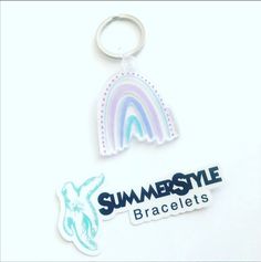 two key chains with the words summer style bracelets and a rainbow shaped sticker