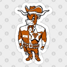 an orange and white cow wearing a cowboy hat