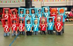 a group of people with question marks on their shirts