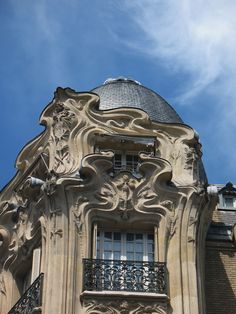 the top of an old building with ornate architecture