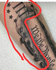 a black and white photo with a red line going through it to the bottom of a tattoo