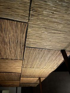 the ceiling is made out of bamboo and it looks like woven fabric or rafters