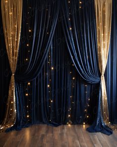 a room with blue curtains and lights on the wall, in front of a wooden floor