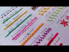 several different colored crochet stitchs are arranged on a piece of paper with writing