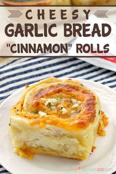 a plate with cheesey garlic bread and cinnamon rolls on it next to a bowl of biscuits