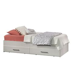 a bed with two drawers underneath it and a blanket on top of the headboard